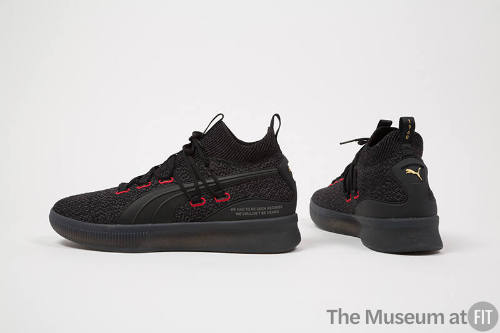 Black tweed lace up sneakers with red stitched eyelets and black rubber soles