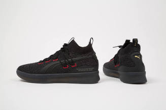 Black tweed lace up sneakers with red stitched eyelets and black rubber soles