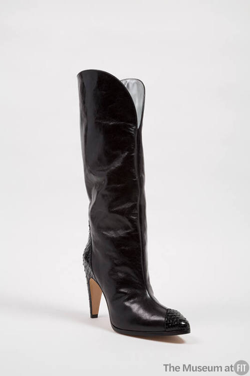 Black knee high boot with pointed python toe and high heel
