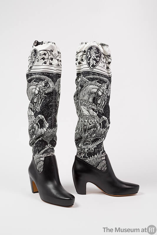 Black leather low heel boots with black and white printed silk above-the-knee uppers