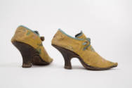 Alternate view of yellow high heeled silk floral design shoes, blue trim, brown leather heels