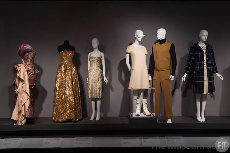 MinMax_30 Left to right  2000.88.1 (dress), 88.75.1 (gold dress), 92.120.1 (dress), 2016.110.3 (glasses), 72.112.19 (dress), 71.213.18DE (boots), 95.72.1 (jumpsuit), 82.69.1 (coat)