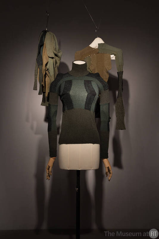 Unraveled_16 95.19.1 (sweaters hanging), 91.175.1 (green sweater)