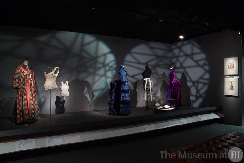 Body_05 Left to right 70.15.16 (robe), P82.31.2 (corset), 99.79.1 (child corset), P82.7.3 (blue dress), 93.169.17 (bustle), 2014.38.3 (dress)