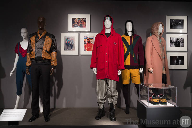BFD_03 Left to right 90.98.81 and 90.98.83 (top and jumpsuit), 2013.87.1 (jacket), 2016.112.1 (hat), 2015.89.2 (jacket), 2015.89.3 (jeans), 2016.83.1 (ensemble), 2016.95.1 (pink ensemble)