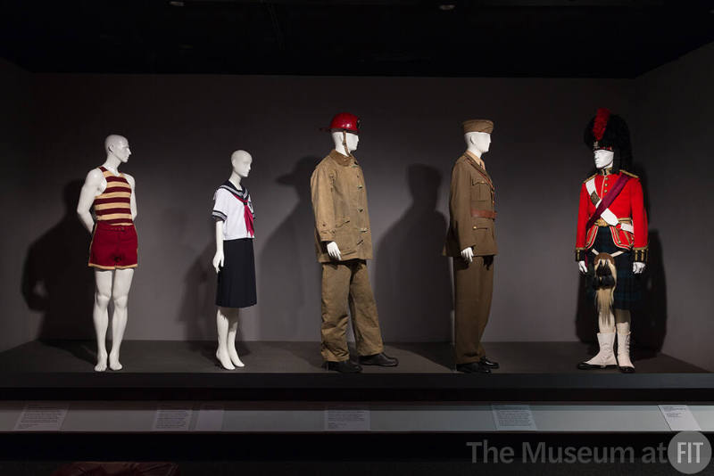 Uniformity_03 Left to right P85.3.2 (swimsuit), 2010.24.2 (school uniform), 2016.11.1 (fire hat), 86.98.1 (suit), 87.17.1 (Army uniform), P88.10.1 (Scottish uniform)