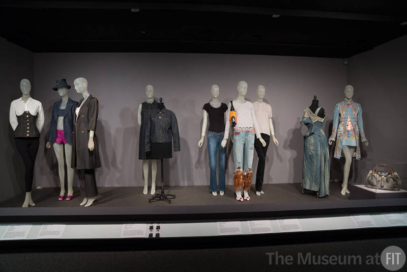 Denim_23 Left and right 99.80.2 (corset), 98.83.1 (ensemble), 99.83.6 (coat ensemble), 2015.72.2 (dress), 2015.72.1 (jacket), 2015.66.1 (jeans), 2015.7.1 (ensemble), 2007.19.2 (black jeans), 2010.37.12 (dress), 2003.45.2 (ensemble), 2007.25.2 (bag)