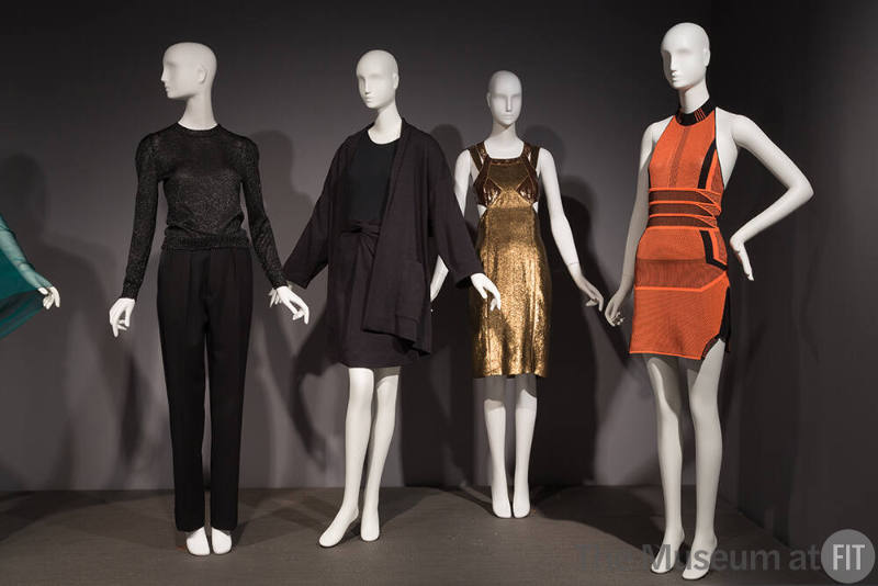 Global_22 Left to right 2003.30.2 (ensemble), 96.53.1 (knit suit), 2005.31.1 (dress), 2015.17.1 (orange dress)