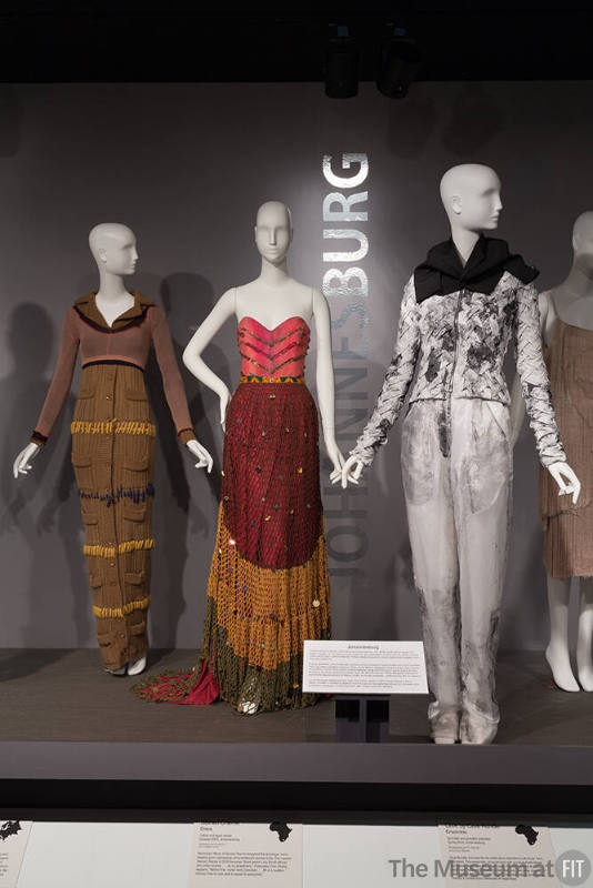 Global_34 Left to right 95.7.2 (dress), 2007.57.1 (dress), 2015.16.1 (pantsuit)