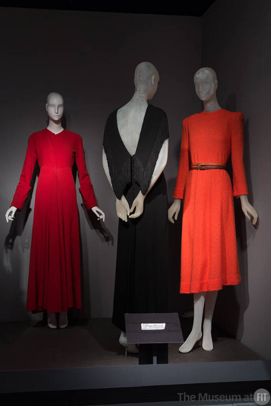 Faking_It_18 Left to right 81.61.10 (coat), 2003.102.1 (dress), 72.54.2 (orange dress)