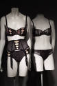 two sets of black bra, panties, and garter belt set 