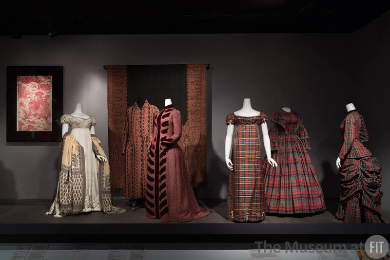 Trendology_08 Left to right 82.189.58 (textile wall), P85.19.1 (dress), P86.71.2 (shawl), 76.208.7 (man's dressing gown), 89.154.12 (dress), 68.175.1 (shawl wall), P88.9.1 (empire dress), 70.15.15 (full skirt dress), P88.22.1 (dress)