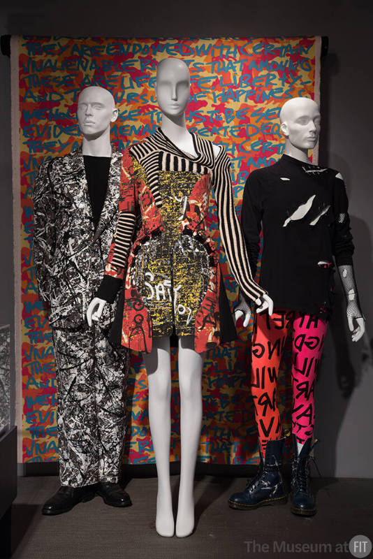 RetroSpective_08 Left to right 88.12.1 (suit), 2005.23.1 (dress), 85.84.2 (leggings), 2004.42.3B (textile wall) 