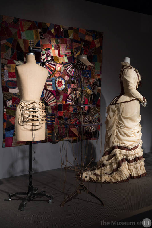 RetroSpective_37 Left to right 2007.63.6 (bustle), P79.1.1 (wire dress form), 81.210.1 (quilt wall), P86.66.1 (dress)