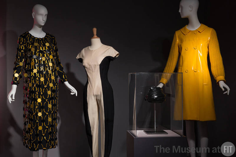 Technology_19 Left to right 71.213.18DE (boots case), 74.107.28 (dress), 88.25.1 (paper dress), 70.62.1 (pink dress), 89.97.17, 75.230.815, 89.61.1 (shoes case), 2005.36.1 (textile wall), 76.205.2 (black and gold dress), 88.78.1 (jumpsuit), 79.213.9 (hat case), 77.21.4 (yellow dress)
