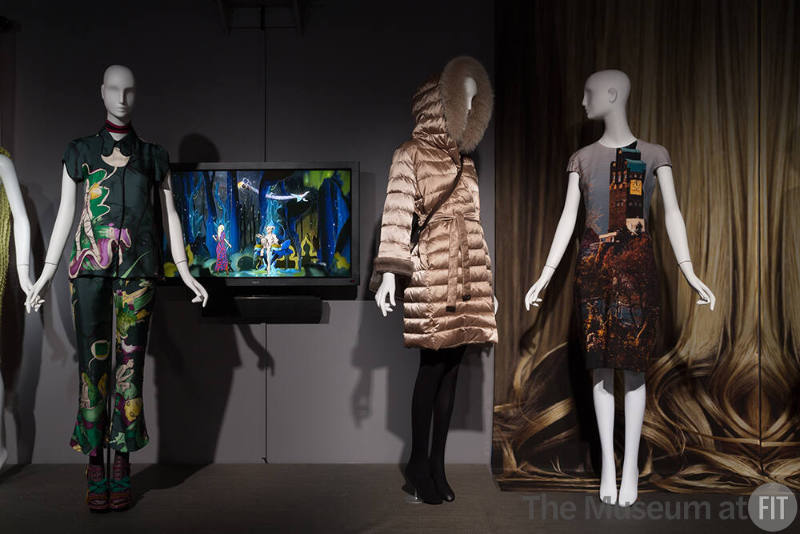 Technology_27 Left to right 2008.45.1 (ensemble), 2011.28.1 (coat), 2012.62.1 (dress), 2005.24.1A&B (textile wall)