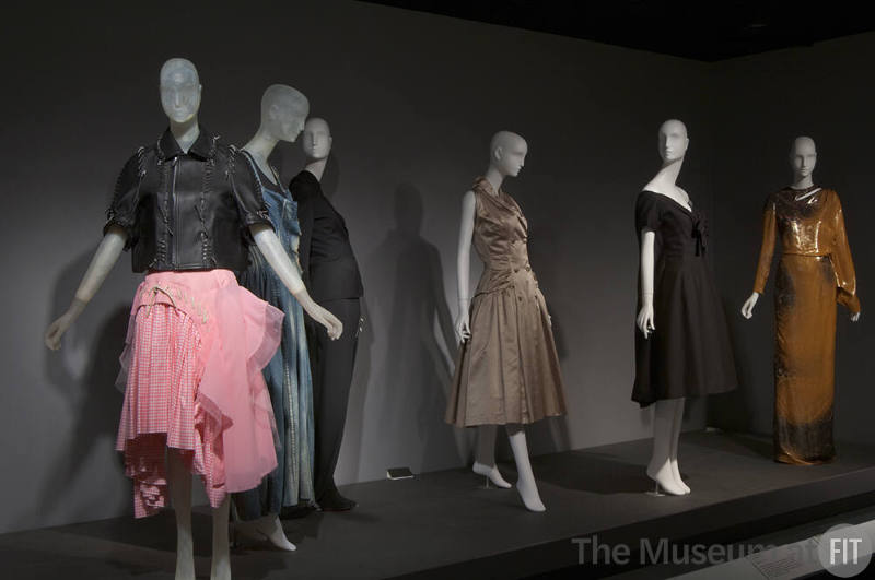 Fashion A-Z (II)_07 Left to right 2005.49.1 (ensemble), 2010.37.12 (denim dress), 97.71.1 (ensemble), 71.213.20 (satin dress), 71.213.30 (dress), 2011.39.1 (metallic dress)