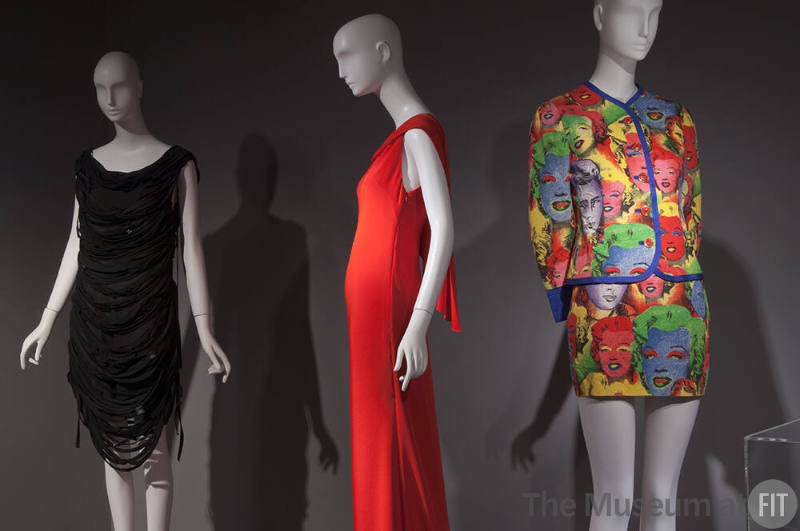 Fashion A-Z (I)_20 Left to right 2008.61.1 (dress), 2011.5.1 (red dress), 2010.56.1 (suit)