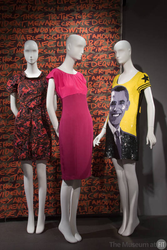 Fashion and Politics_11 Left to right 2009.20.1 (dress), 2004.42.3B (textile wall), 2009.49.1 (pink dress), 2009.39.1 (Obama dress)