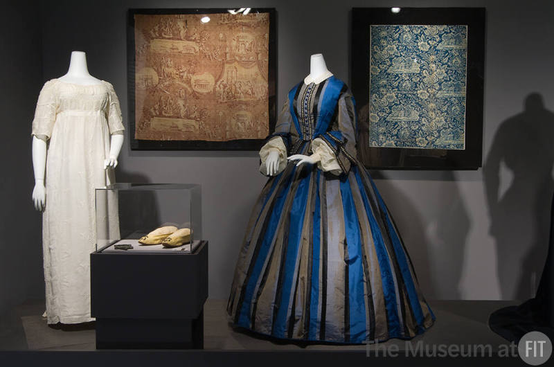 Fashion and Politics_32 Left to right P78.1.1 (dress), 71.192.82 (textile wall), 2008.84.22 (shoes case), P88.46.1 (dress), X321.48 (textile wall)