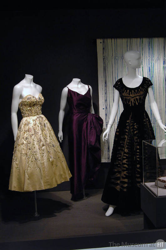 Arbiters_112 Left to right 75.86.5 (dress), 74.135.7 (purple dress), 2003.88.1 (textile wall), 86.133.1 (black dress)