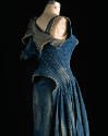 Back view of sleeveless stone washed peiced denim dress with raw edges