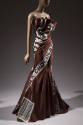 3/4 view of brown and grey strapless dress with Chocolate Bar print, gathered bodice, floor-len…