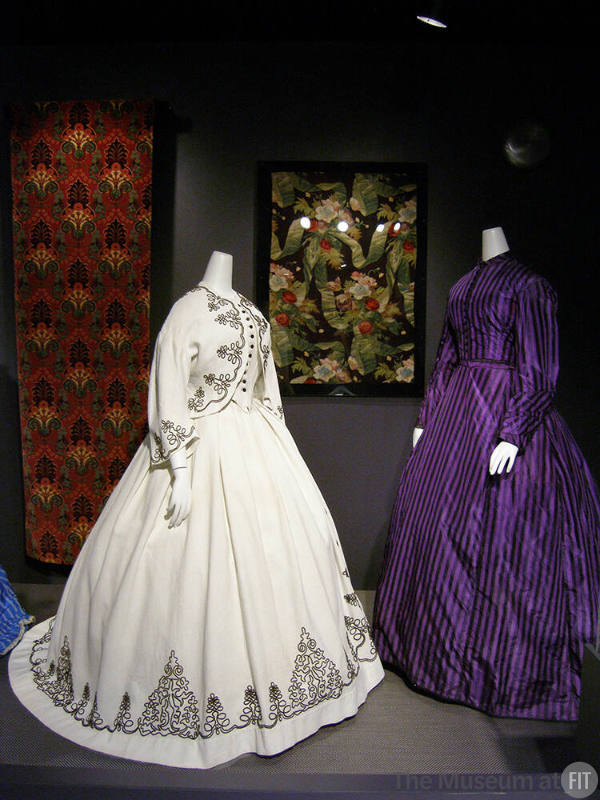 Rainbow_21 Left to right P90.77.1 (textile wall), P90.22.2 (white dress), 84.31.2B (textile wall), 2006.43.1 (purple dress)