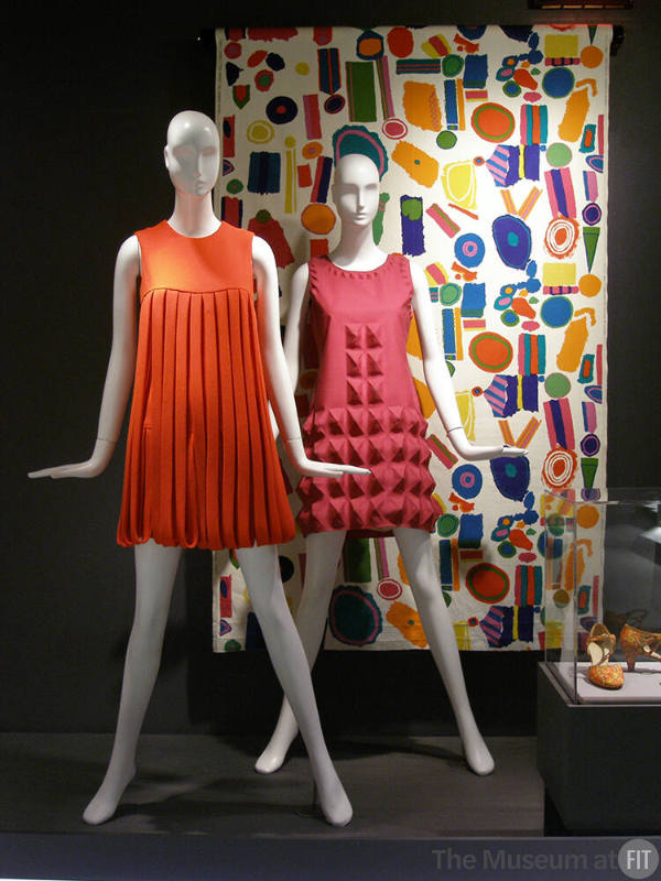 Rainbow_65 Left to right 82.3.2 (orange dress), 70.62.1 (pink dress), 2003.89.1 (textile wall), U.368 (shoes case)