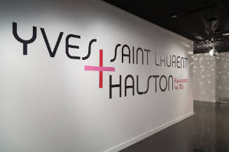 Yves Saint Laurent + Halston: Fashioning the 70s exhibition installation view of the gallery en…