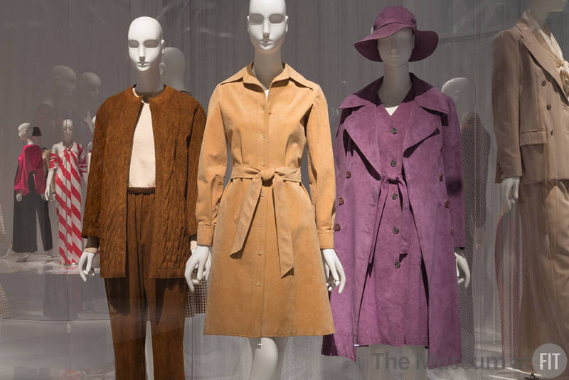 YSL+Halston_11 Left to right 81.65.19 (pantsuit), 82.193.4 (tan coat dress), 82.80.5 (hat), 78.242.170 (purple coat ensemble)