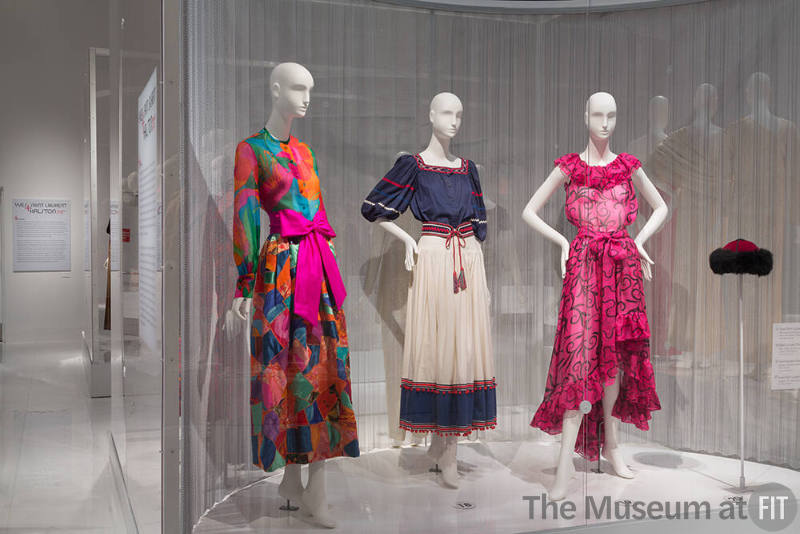 YSL+Halston_14 Left to right 75.108.9 (floral ensemble), 81.218.4 (dress), 91.235.24 (pink ensemble), 82.52.10 (hat)