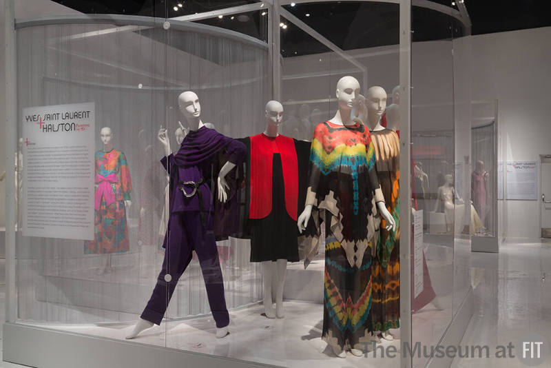 YSL+Halston_37 Left to right 91.241.32 (purple ensemble), U.2167 (belt),  82.42.4 (red and black cape and dress), 80.71.7 (tie dye ensemble), 91.241.11 (brown tie dye ensemble)