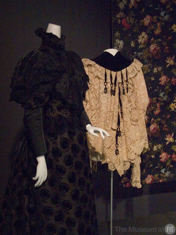First_Rotation_039 Left to right 2005.9.1 (dress), 69.160.9 (cape), 2005.64.1 (textile wall)
