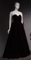 Dark purple strapless floor length evening dress with fitted bodice and full skirt