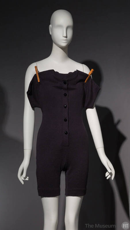 union suit on a clothes line, in black linen knit with clothespins