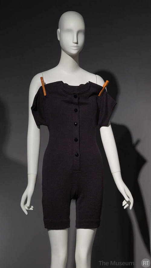union suit on a clothes line, in black linen knit with clothespins