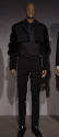 Man’s black ensemble of bolero jacket with fur sleeves, polka dot button front shirt, slim pant…