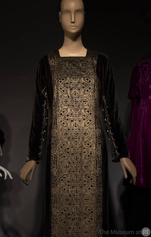 Black velvet long sleeve square neck dress with gold metallic print front, gold braid at sleeve…