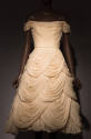 Ivory strapless cocktail dress with draped cowl neck, off the shoulder sleeves and multiple tie…