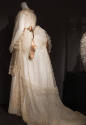 Back view of sheer net bodice, apron and skirt with bustle and train, embroidery throughout and…