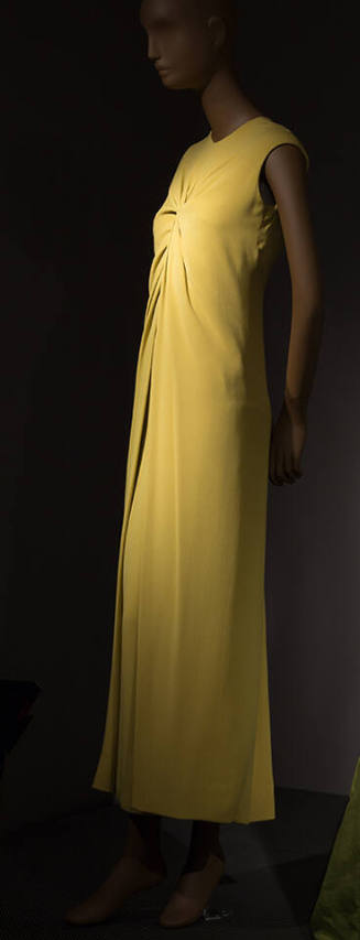 Sleeveless lime green floor length evening dress with twist drape at center front bust