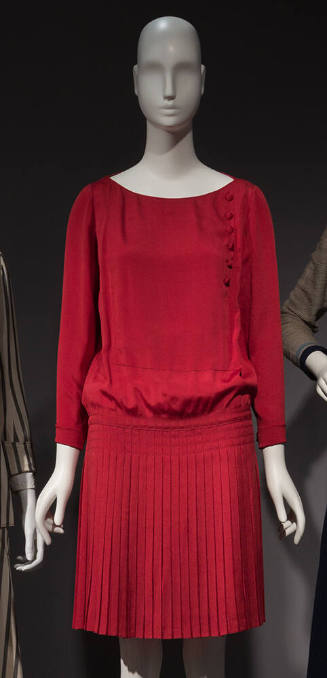 Red long sleeve day dress with drop waist & knee length pleated skirt